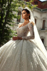 Elegant Long Sleeve Ball Gown Tulle Wedding Dress with Beads